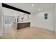 Spacious dining area adjacent to the kitchen with an open floor plan and natural light at 671 Elati St, Denver, CO 80204