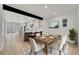 Elegant dining area open to the kitchen, complete with a modern table setting at 671 Elati St, Denver, CO 80204