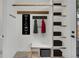 Inviting entryway featuring a coat rack, built-in shelving, and stylish design elements at 671 Elati St, Denver, CO 80204