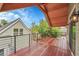 Expansive wood deck with cozy seating, wood ceiling, and neighborhood views at 671 Elati St, Denver, CO 80204
