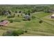 Scenic aerial view of a secluded home featuring a large fenced yard and lush greenery at 9163 N Palomino Dr, Castle Rock, CO 80108