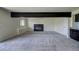 Spacious finished basement with fireplace, neutral carpet, and wet bar potential at 9163 N Palomino Dr, Castle Rock, CO 80108
