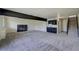 Finished basement featuring carpet, a black marble fireplace, and wet bar at 9163 N Palomino Dr, Castle Rock, CO 80108