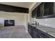 Finished basement with a wet bar, fireplace, and carpeted floors at 9163 N Palomino Dr, Castle Rock, CO 80108