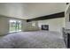 Finished basement features a sliding glass door, fireplace, and wet bar at 9163 N Palomino Dr, Castle Rock, CO 80108