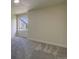 View of bedroom showcasing neutral walls, carpeted floors, and a bright window at 9163 N Palomino Dr, Castle Rock, CO 80108