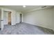 Bedroom with neutral carpet, closet, and access to a shower and separate door at 9163 N Palomino Dr, Castle Rock, CO 80108