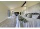 Bright bedroom with fireplace, vaulted ceiling, ensuite bathroom and outdoor access at 9163 N Palomino Dr, Castle Rock, CO 80108