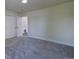 View of the bedroom featuring carpeted floors and a door leading to the hallway at 9163 N Palomino Dr, Castle Rock, CO 80108