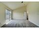 Bright bedroom with plush carpet and access to a private balcony through sliding glass doors at 9163 N Palomino Dr, Castle Rock, CO 80108