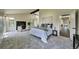 Primary bedroom featuring a fireplace, neutral colors and ample natural light at 9163 N Palomino Dr, Castle Rock, CO 80108