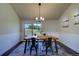 Dining room with modern chandelier and large windows showcasing outdoor views at 9163 N Palomino Dr, Castle Rock, CO 80108