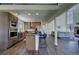 Open kitchen with stainless steel appliances, center island and bar seating at 9163 N Palomino Dr, Castle Rock, CO 80108