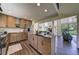 Spacious kitchen featuring a large center island and wood cabinets at 9163 N Palomino Dr, Castle Rock, CO 80108