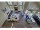 Overhead view of the living room, showcasing the beautiful fireplace and sliding glass door access to the yard at 9163 N Palomino Dr, Castle Rock, CO 80108