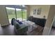Cozy living space with large windows, comfortable seating, and seamless access to outdoor areas at 9163 N Palomino Dr, Castle Rock, CO 80108