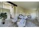 Spacious main bedroom showcasing high ceilings, ceiling fan, neutral tones, and comfortable seating at 9163 N Palomino Dr, Castle Rock, CO 80108