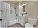 Clean bathroom with white vanity, shower/tub combo, and patterned curtain at 15235 W 43Rd Ave, Golden, CO 80403