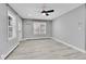 Bright living room with gray walls and wood-look floors at 15235 W 43Rd Ave, Golden, CO 80403