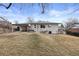 Spacious backyard featuring a covered patio, ideal for enjoying the outdoors at 2765 S Winona Ct, Denver, CO 80236