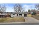 Charming single-story home with a well-maintained front yard and an attached garage at 2765 S Winona Ct, Denver, CO 80236