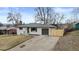 Charming home with a well-kept front yard and modern garage door enhances curb appeal at 2765 S Winona Ct, Denver, CO 80236