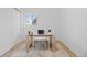 Bright home office with a simple desk setup and neutral decor, perfect for a productive workspace at 2765 S Winona Ct, Denver, CO 80236