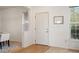 Inviting entryway featuring a white front door, light hardwood floors, and ample natural light at 4340 Nelson Dr, Broomfield, CO 80023