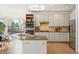 Bright kitchen features stainless appliances, granite countertops, and a view of the backyard at 4340 Nelson Dr, Broomfield, CO 80023