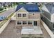 Back of house with vinyl siding, a patio and sliding glass doors leading to a fenced gravel backyard at 4404 Walden St, Denver, CO 80249