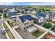 A view of a two story home's backyard showing gravel landscaping, a small lawn, and a privacy fence at 4404 Walden St, Denver, CO 80249