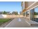 Backyard featuring sliding door to house and concrete patio at 4404 Walden St, Denver, CO 80249