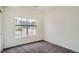 Bedroom with carpet flooring and a window overlooking the street at 4404 Walden St, Denver, CO 80249