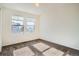Bright bedroom with two windows and neutral carpet, offering a cozy and inviting space at 4404 Walden St, Denver, CO 80249