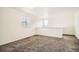 Versatile bonus room with neutral carpet and natural light, ideal for flexible living spaces at 4404 Walden St, Denver, CO 80249