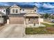 Charming home exterior featuring a well-maintained lawn and a welcoming entrance for a cozy appeal at 4404 Walden St, Denver, CO 80249