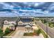 A charming two-story home features a well-manicured lawn and a welcoming entrance with solar panels at 4404 Walden St, Denver, CO 80249
