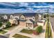 This tan home boasts solar panels, a two-car garage, a well manicured yard, and professional landscaping at 4404 Walden St, Denver, CO 80249