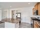 Kitchen with an island, stainless steel appliances, and plenty of cabinet space for storage at 4404 Walden St, Denver, CO 80249