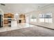Open-concept kitchen and living room, with modern appliances, a kitchen island, and ample natural light at 4404 Walden St, Denver, CO 80249