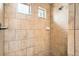 Bathroom tiled shower with window at 4404 Walden St, Denver, CO 80249