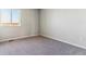 Simple bedroom with grey carpet and a window at 3484 N Irvington St, Aurora, CO 80019