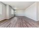 Spacious living room with vinyl plank flooring and large windows at 3484 N Irvington St, Aurora, CO 80019