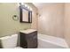 Bathroom boasts a tiled shower, vanity with storage, and modern fixtures for a luxurious feel at 1021 Stuart St, Denver, CO 80204