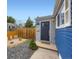 Inviting front entrance with a dark door, modern address numbers, gravel, and fresh landscaping details at 1021 Stuart St, Denver, CO 80204
