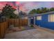 Charming home featuring a blue exterior, welcoming entrance, and modern landscaping with a wooden fence at 1021 Stuart St, Denver, CO 80204