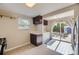Well-lit kitchen featuring stainless steel appliances, wood cabinets, and a sliding glass door that offers access to a patio at 1021 Stuart St, Denver, CO 80204