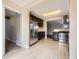 Modern kitchen featuring stainless steel appliances, dark wood cabinetry, and tile flooring is stylish at 1021 Stuart St, Denver, CO 80204
