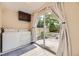 Bright laundry room with washer, dryer, storage, and sliding glass door to a private backyard patio at 1021 Stuart St, Denver, CO 80204