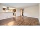 Open-concept living room with dark hardwood floors adjoining a modern kitchen at 1021 Stuart St, Denver, CO 80204